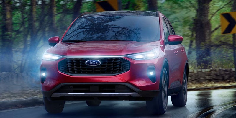 Dynamic front view of the 2026 Ford Escape handling snow-covered roads in northwest Wyoming near Greybull