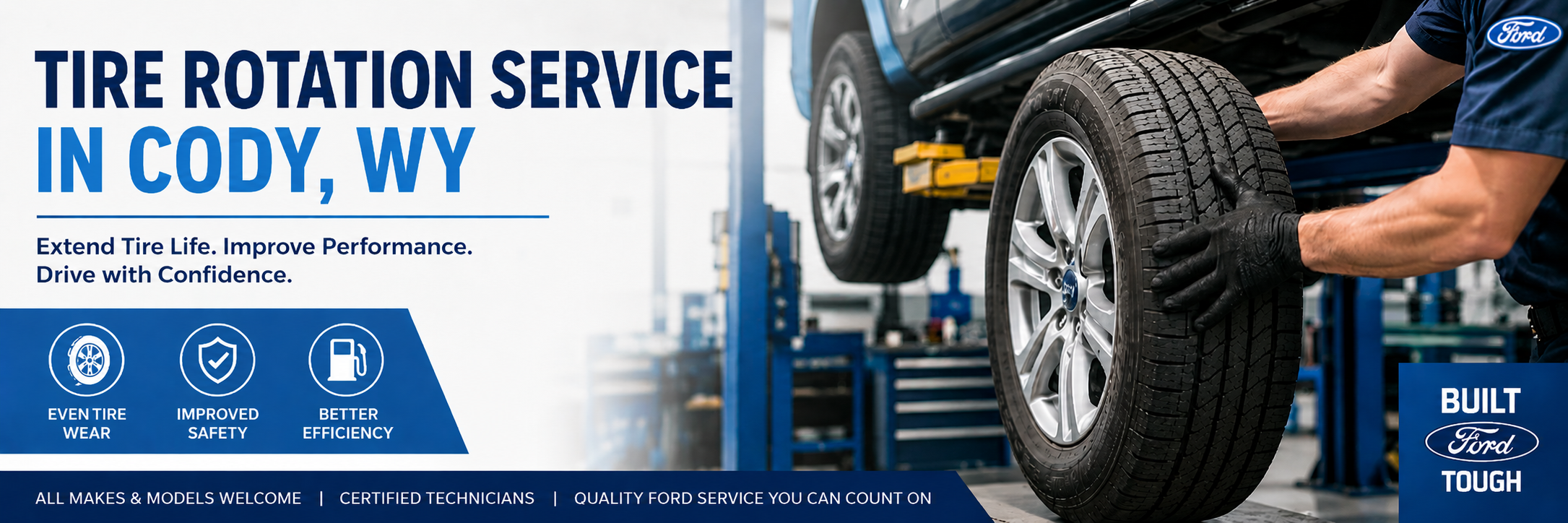 Mechanic balancing a large tire at Fremont Motor Cody Ford